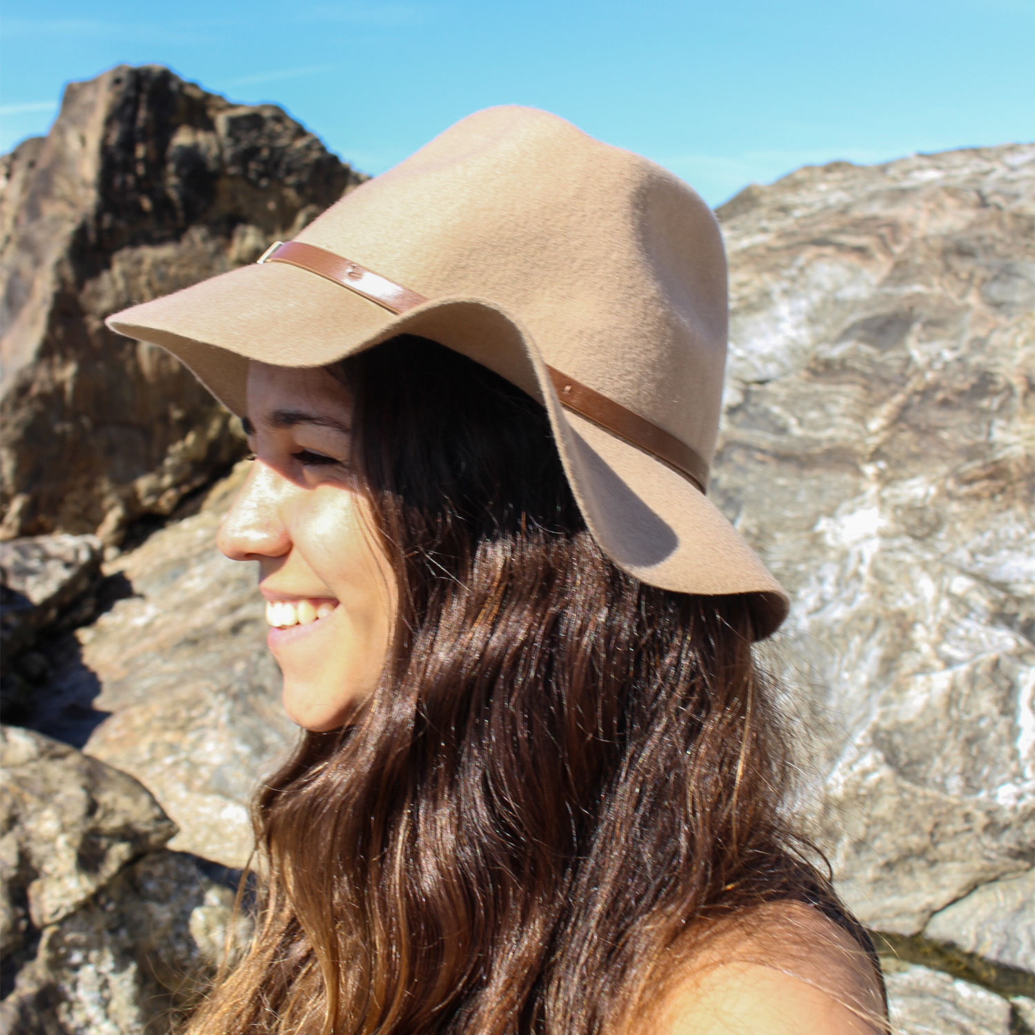 Selene with a hat at the beach of Porto, Portugal